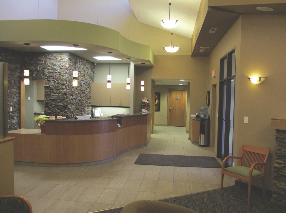 The warm, rich-textured, and welcoming look of the front desk area was used throughout the entire space. 