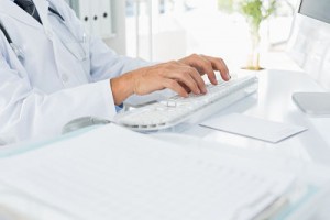 http://www.dreamstime.com/stock-photography-mid-section-doctor-using-computer-keyboard-medical-office-close-up-male-image39223142