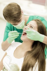 http://www.dreamstime.com/royalty-free-stock-image-young-woman-dentist-women-checup-image41623276