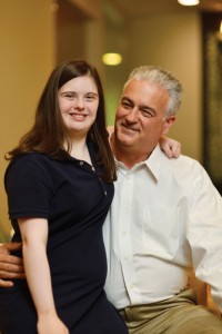 Greer and his daughter, Lindsey. Having a daughter with Down syndrome, he says, has given him unique insight regarding the nuances of how to provide orthodontic treatment to this patient base.