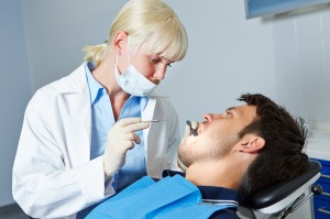 http://www.dreamstime.com/royalty-free-stock-photo-dentist-examining-patient-toothache-female-denture-image33373775